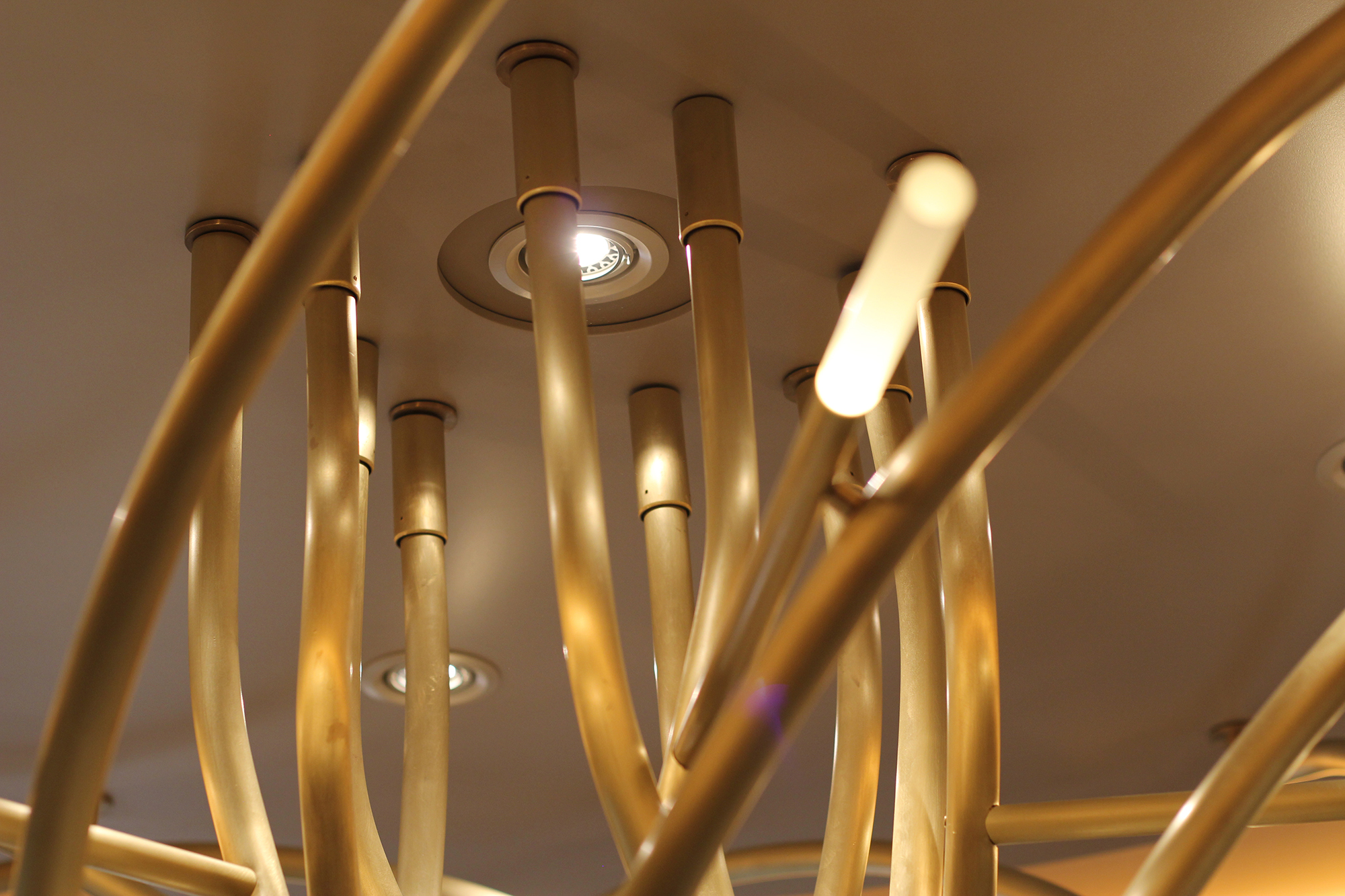 Ceiling detail showing sleeved flanges and with slight reveals to allow
       for the deformation of the ship and to dampen vibration.